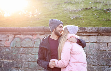 Poster - Young romantic couple hugging outdoors