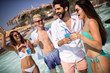 © NDABCREATIVITY - Group of friends having fun on summer vacation. Lifestyle, friendship, travel and holidays concept