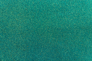 Beautiful turquoise paper background. Empty space concept. Brilliant shiny backdrop from textile. Shimmer denim paper