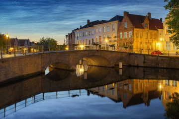 Wall Mural - Noctilucent clouds (night shining clouds) at city Bruges (Brugge) old town in Belgium in the dusk, Europe