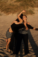 Wall Mural - Group of women engaged in body therapy in nature