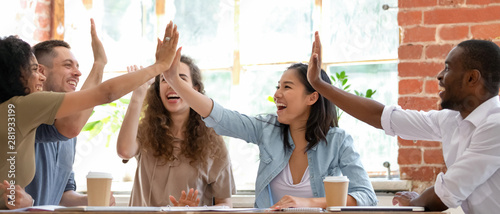 Excited employees or students feels happy giving high five Tableau sur Toile