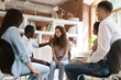 © fizkes - Diverse people gather together at group therapy discuss personal problems