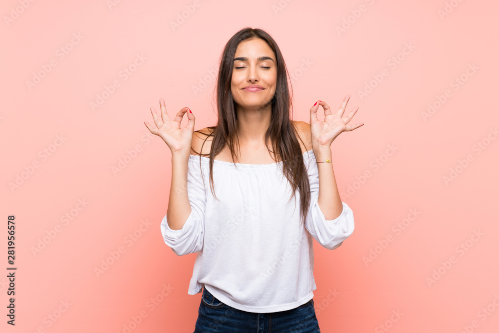 Young woman over isolated pink background in zen pose - obrazy, fototapety, plakaty 