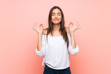 Young Woman Over Isolated Pink Background In Zen Pose