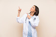 © luismolinero - Young doctor woman over isolated background pointing with the index finger a great idea