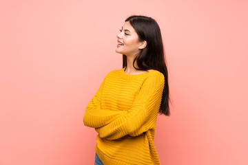 Wall Mural - Teenager girl  over isolated pink wall happy and smiling