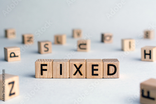 Cuadros en Lienzo Fixed - word from wooden blocks with letters, fixed interest rates or costs con
