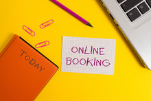 Handwriting Text Writing Online Booking. Conceptual Photo Reservation Through Internet Hotel Accommodation Plane Ticket Laptop Clips Pencil Paper Sheet Hard Cover Notebook Colored Background