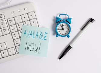 Text sign showing Available Now. Business photo text you can find it obtain or operable at this current moment White pc keyboard with empty note paper above white background