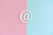 © Juliaap - Email symbol on blue and pink background. Concept for email, communication or contact us