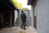 Fototapeta  - Burglar in black clothes