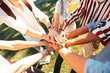 © zinkevych - Hands of groupmates lying one on another.