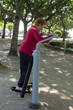© tetxu - happy senior woman doing exercises and gymnastics outdoors