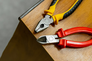 red wire cutters pair electrical wiring cleaning laying of wires on edge machine tool engineer