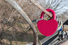 Big Purple Heart Shaped Love Padlock Hanging On Lovers Bridge. Conceptual Symbol Of Unbreakable Love And Unity Of A Couple. Purple Love Padlock With Copy Space For Text On It.
