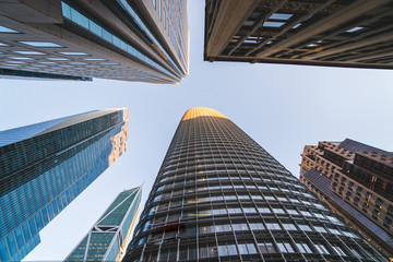 Looking up at tall high skyscraper buildings in San Francisco in the Financial District, California