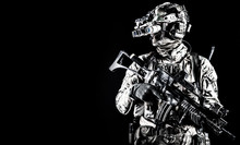 Soldier In Night Vision Device On Black Background