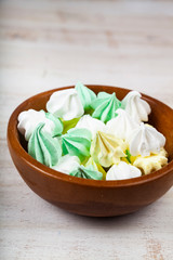 Wall Mural - Meringue in a bowl on a wooden background