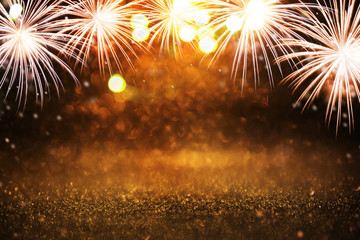 Wall Mural - gold and silver fireworks and bokeh in new year eve and copy space. abstract background holiday.