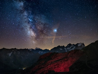 Wall Mural - milky way and starry sky on the alps, massif des ecrins, briancon serre chevalier ski resort, france