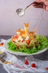 Wall Mural - Tempura Jumbo Shrimps with salad and salsa dip on white plate