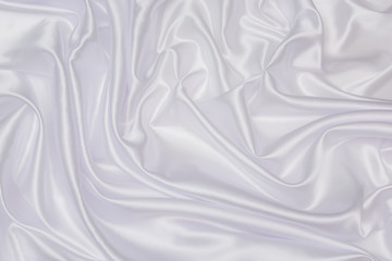 Crumpled of white satin for abstract and design, Detail and grooved of fabric for background and textured