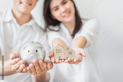 Fotografía Couple saving money for buying new house concept