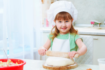 portrait of cute baby chef happiness laughing