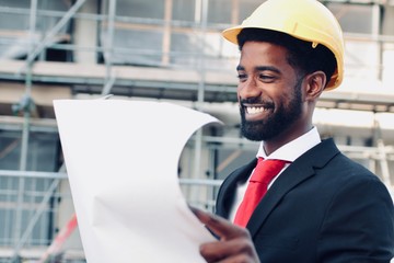 Construction worker and architect outside