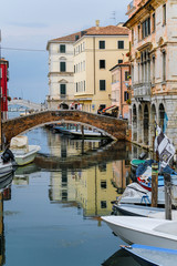 Wall Mural - Sottomarina, Italy - July, 07, 2019: cityscape with the image of channel in Sottomarina, Italy, the small town near Venice