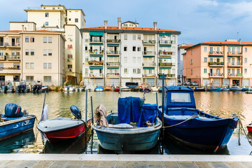 Wall Mural - Sottomarina, Italy - July, 07, 2019: cityscape with the image of channel in Sottomarina, Italy, the small town near Venice