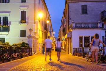 Wall Mural - Adria, Italy - July, 11, 2019: one of the central streets of Adria, Italy, in the evening