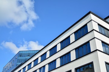 modern building with blue sky and clouds