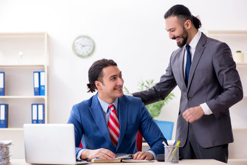 Two male colleagues in the office