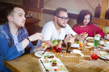 Group of young people at a table in a bar