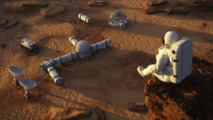 Wall Mural - astronaut on planet mars, sitting on a cliff above a research station