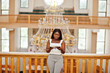© AS Photo Family - African american woman praying in the church. Believers meditates in the cathedral and spiritual time of prayer. Afro girl with holy bible at hands.