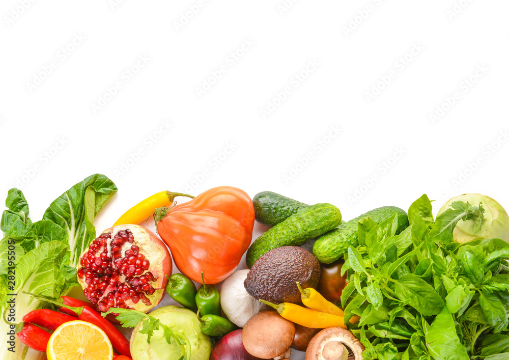 Assortment of fresh vegetables with fruits on white background