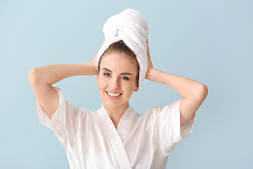 Wall Mural - Beautiful young woman after washing hair against color background