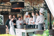 © davit85 - Restaurant manager and his staff in terrace. interacting to head chef in restaurant.