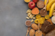 Assortment of food rich on fiber and carbohydrates on gray