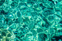 Turquoise Sea Surface With Transparent Shallow Water - Pebbles, Stones, Rocks On The Seabed