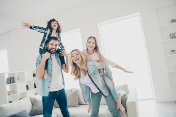 Wall Mural - Photo of big family four members having best free time hands like wings airplane flight indoors apartments