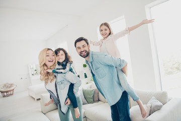 Sticker - Photo of four family members having best free time pretend funny flight airplane indoors apartments