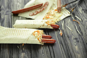 Wall Mural - lavash with spicy sausage and vegetables.photo with copy space