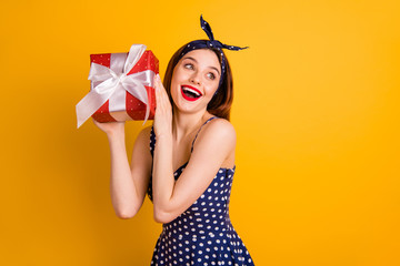 Poster - portrait of charming lady hold hand giftbox 14-february 8-march look isolated over yellow background