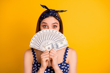 Poster - Close up photo of cute funny lady student hide face savings big sum isolated over yellow background