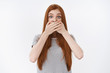 © Cookie Studio - Shocked amused young redhead girl learn incredible rumor widen eyes raise eyebrows surprised cover mouth speechless gasping standing amazed under impression, white background