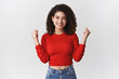 © Cookie Studio - Yes new achievement. Girl winning lottery celebrating happily feel winner triumphing clench fists success victory gesture smiling delighted accomplish goal, standing rejoicing heerful